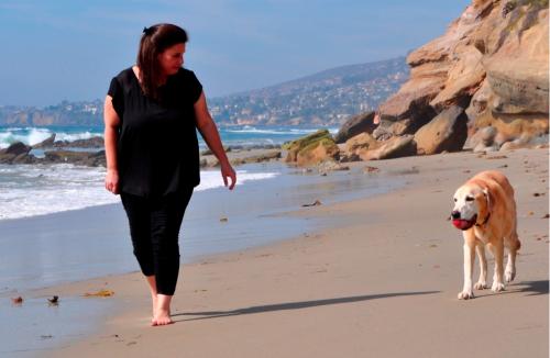 Walking dog on beach